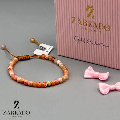 دستبند سنگی نارنجی با گوی طلای گرد