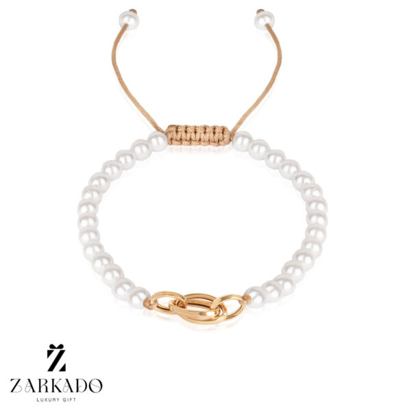 دستبند مرواریدی سفید با پلاک طلا طرح لکسوس