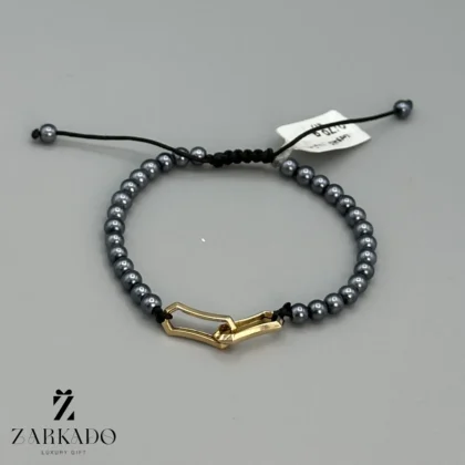 دستبند مروارید نوک مدادی با پلاک طلا مدل هرمس