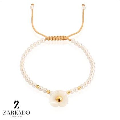 دستبند مرواریدی و گوی البرنادو طلا طرح گل نیلوفر آبی