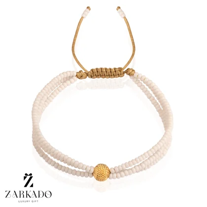 دستبند میوکی سفید سه رج و گوی طلا چکشی