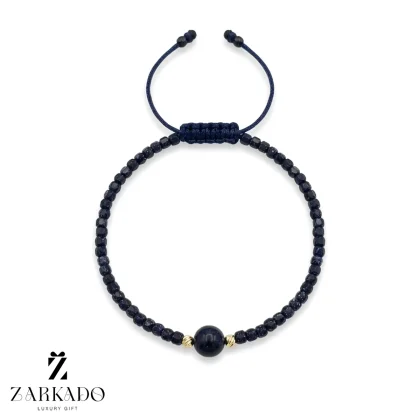 دستبند سنگی و گوی البرنادو و مروارید پرورشی سورمه ای